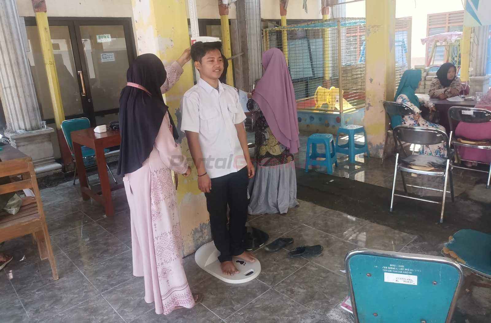 Pelayanan Kesehatan Pemerintah Desa Tebalo, Kecamatan Manyar, melalui program Posyandu Integrasi Layanan Prima (ILP) yang digelar rutin setiap bulan.